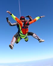 A young man and his tandem master are pictured mid-jump while skydiving in Tallard.