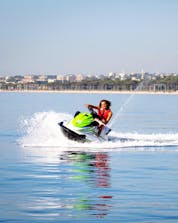 A man is having fun while jet skiing during his tour with Jet Ski Hire in Cagnes-sur-Mer with Plage des Marines.