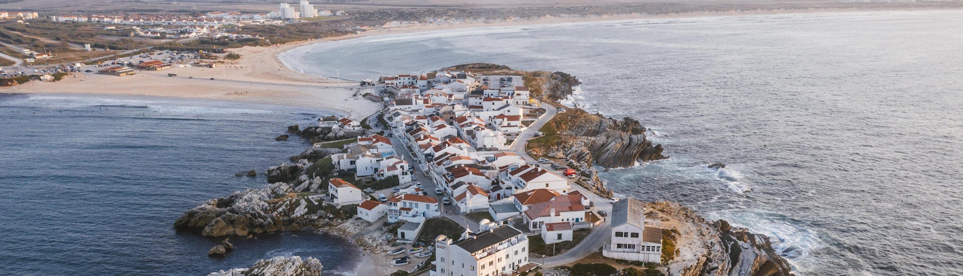 An areal view of the rocky peninsula that can be seen by visitors who go surfing in Peniche.