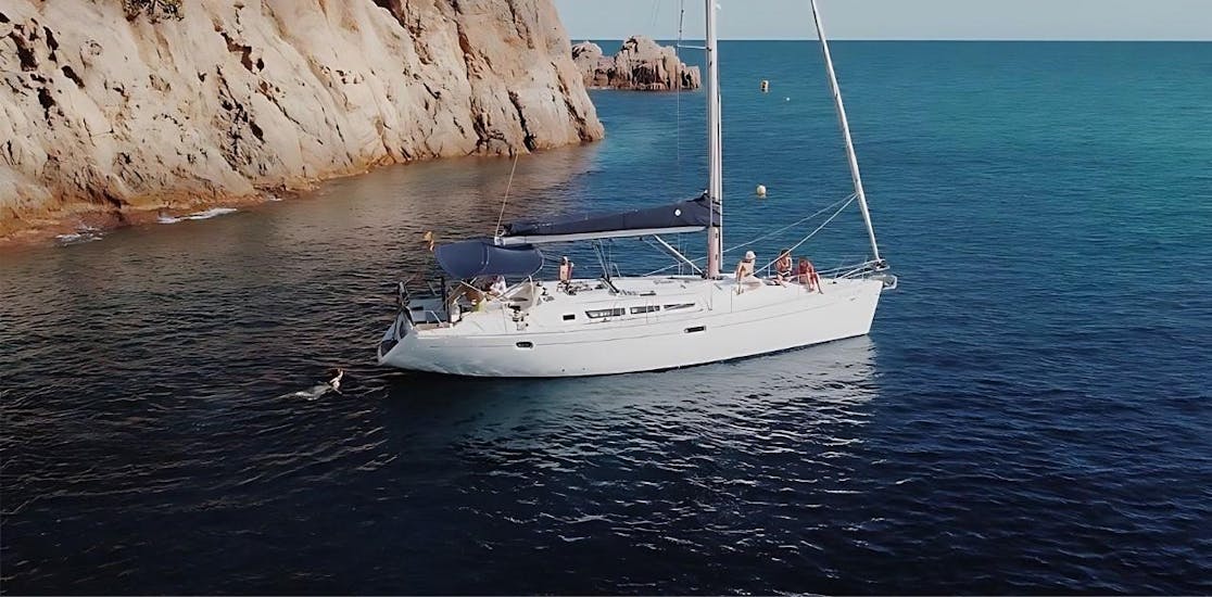 Our sailing boat in the waters of Platja d'Aro from Bad Cat Sailing Platja d'Aro.