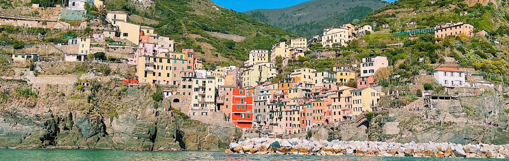 The village of Riomaggiore seen from the sea during the sailing boat trip from La Spezia to Cinque Terre with Lunch with Velagiovane.