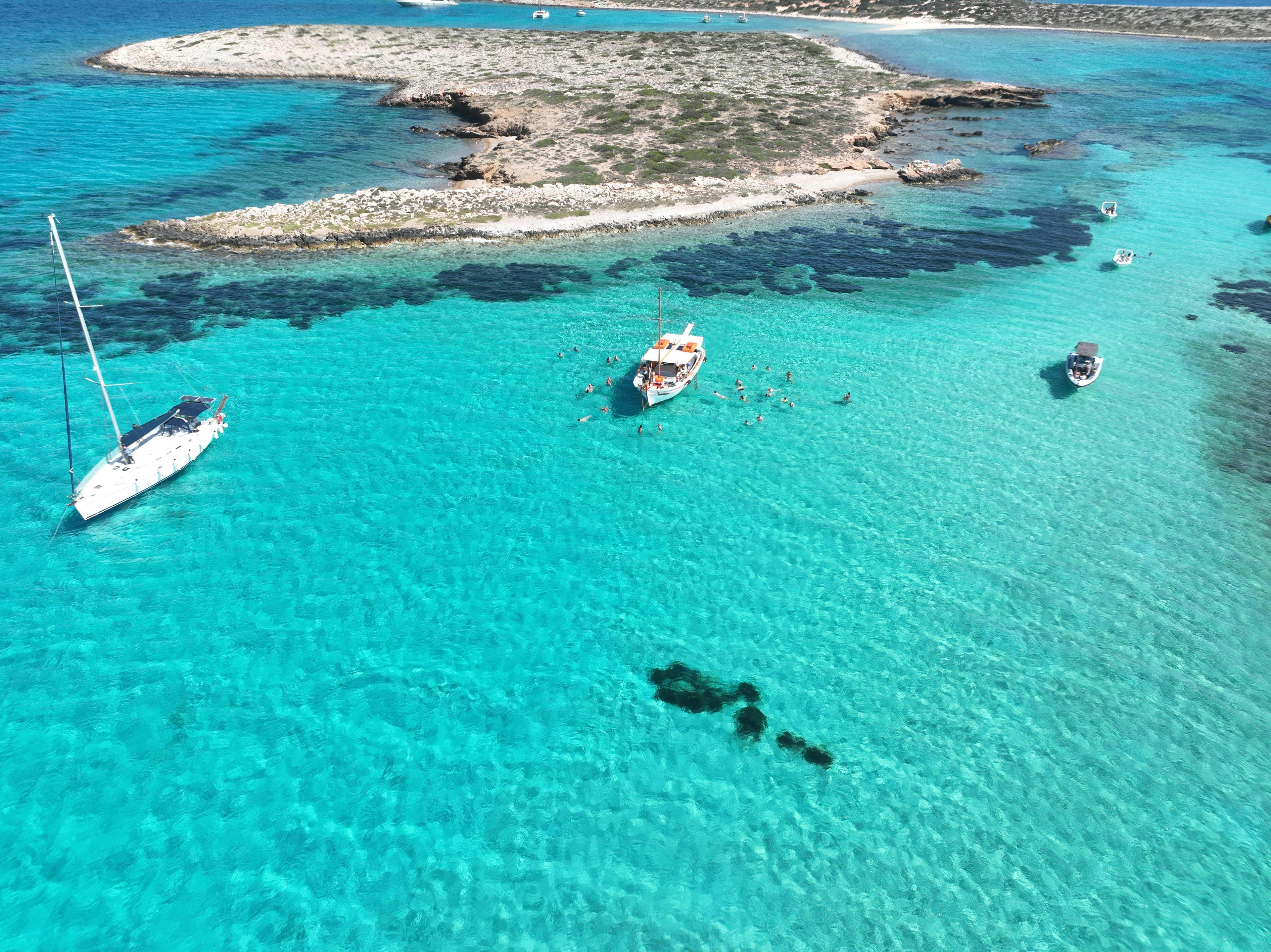 Voreas Paros Cruises Some sailing boats of Voreas Paros Cruises in the turquoise waters near Paros during a sailing boat trip.
