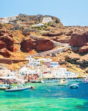 An image of the old port in Oia, a popular place to do water sports in Santorini.