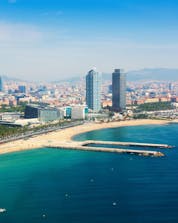 The impressive and beautiful view of the city and the shore where you can practice different water sport activities in Barcelona.