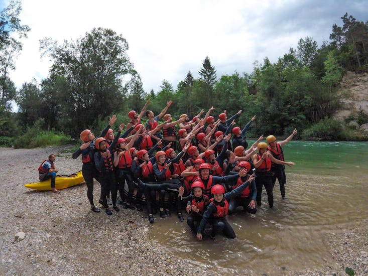 A group posing for a picture taken during a tour with Sava rafting Bled.