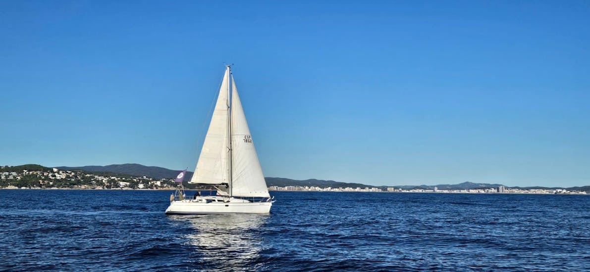Our sailing boat in the waters of Costa Brava with Set Sail Costa Brava.