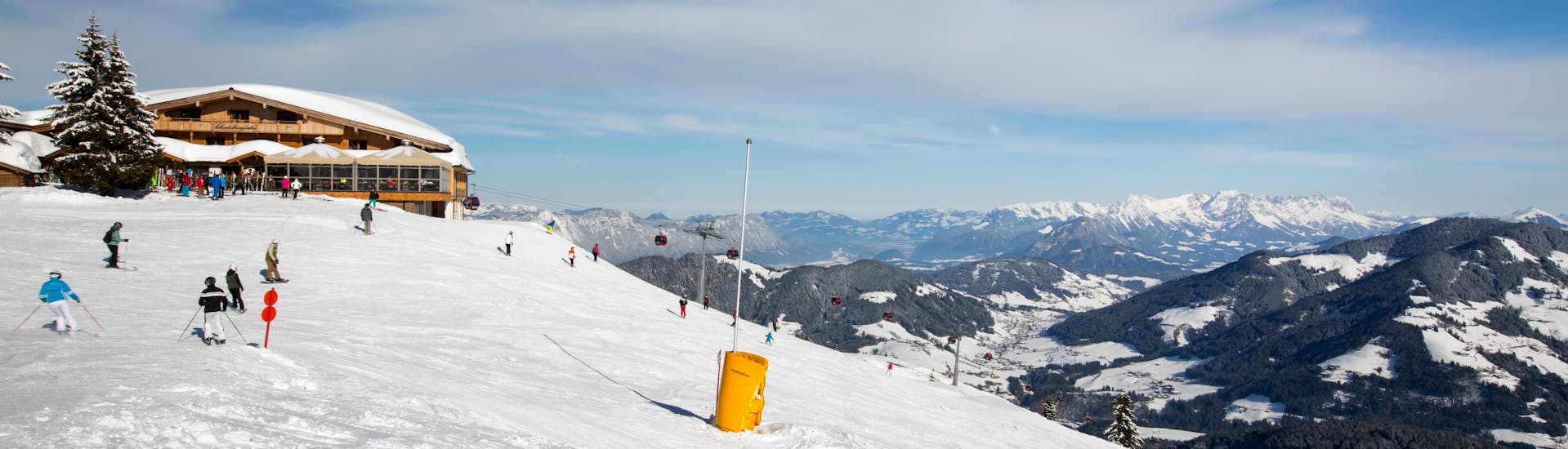 A view of a snowy mountain top in the ski resort of Ski Juwel Alpbachtal Wildschönau, where ski schools gather to start their ski lessons.
