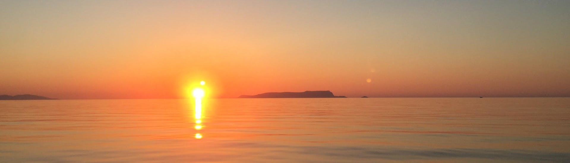 The sunset that you will be able to see during one of the boat trips with Zorbas Cruises Hersonissos.