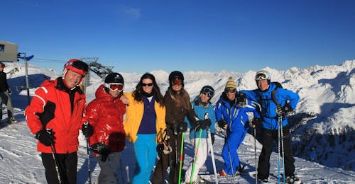 ski-lessons-for-adults-all-levels-altitude-verbier The group of skiers are taking a break during the Adults Ski Lessons with Altitude Ski School Verbier & Gstaad.