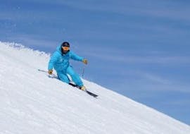 A Private Ski Touring Guide - All Levels from the ski school ESI Font Romeu is skiing down a snowy slope.
