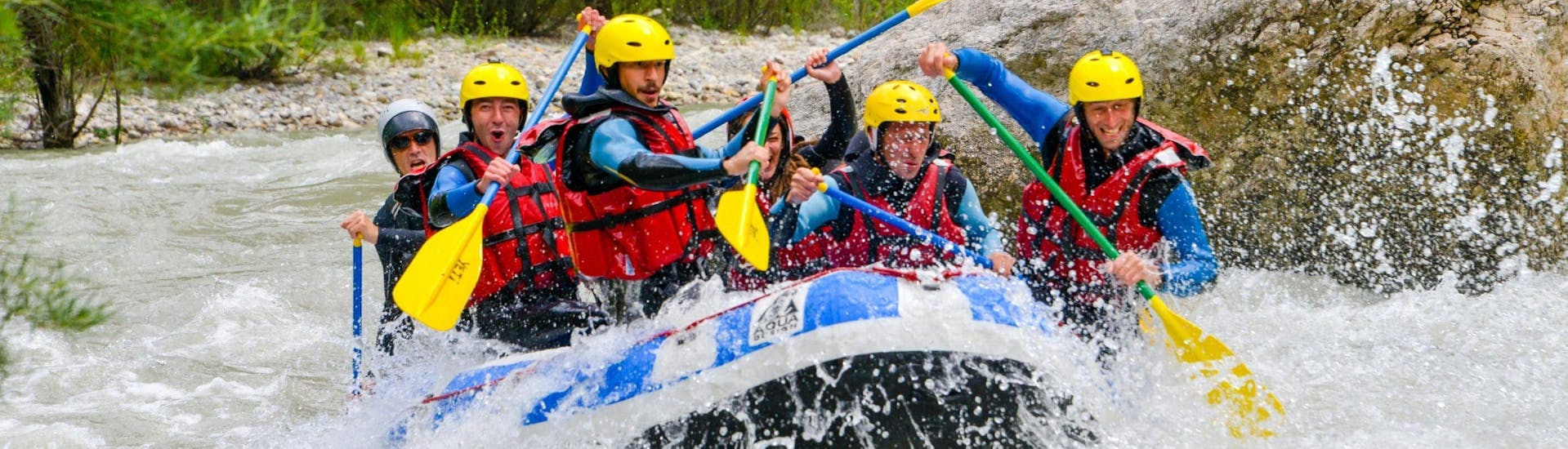 A group is caught in rapids on the Verdon river and is having fun during the Classic rafting descent organized by Yeti Rafting in low season.