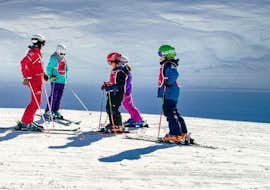 Kids Ski Lessons (5-12 y.) in Vallorcine/La Balme from Ski School ESF Vallorcine Children listen to the instructions of their ski instructor during their Kids Ski Lessons (6-12 years) - Advanced with ski school ESF Vallorcine.