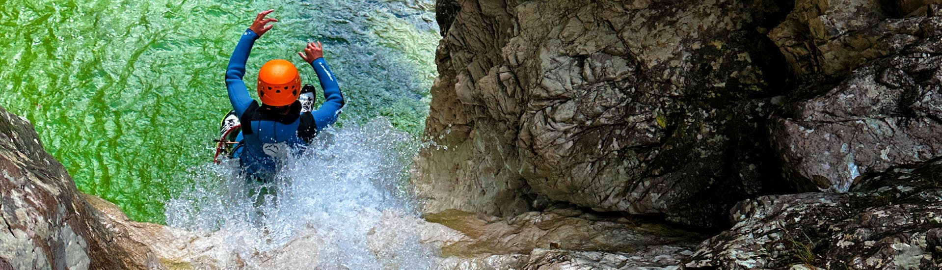 A participant in the water during Canyoning in the Fratarica Gorge near Bovec.