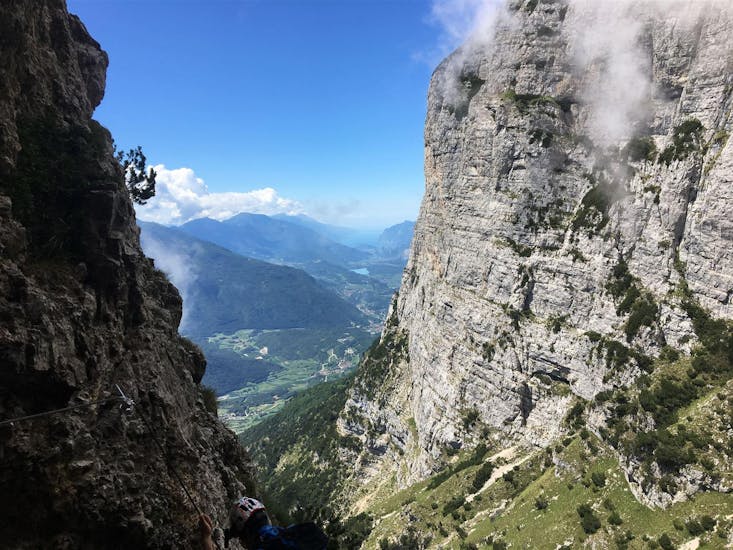 A fantastic view on the valley that can be admired during the Via Ferrata delle Aquile in Paganella - Long Route with Mmove - Into Nature Lago di Garda.