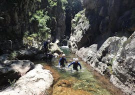 A group of people are following their guide during their canyoning activity "La Perle" at the Canyon du Tapoul with B&ABA Sport Nature.