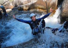 A man is jumping during his canyoning activity "Ludique" in the Canyon de la Dourbie with B&ABA Sport Nature.