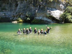 A group of people are following their guide during their canyoning river trekking "fun" in the Canyon Pas de Soucy with B&ABA Sport Nature.