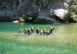 A group of people are following their guide during their canyoning river trekking "fun" in the Canyon Pas de Soucy with B&ABA Sport Nature.
