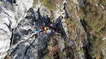 A group of participants is climbing up the mountain during the Via Ferrata sul Monte Colodri ad Arco con LOLgarda di LiveOutdoorLife.