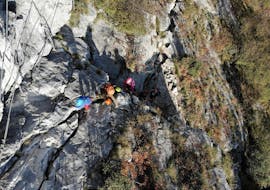 A group of participants is climbing up the mountain during the Via Ferrata sul Monte Colodri ad Arco con LOLgarda di LiveOutdoorLife.