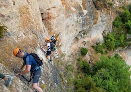 Via Ferrata of Liaucous in Gorges du Tarn with Antipodes Sport Nature Millau People climbing in a mountain
