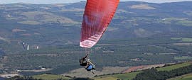 A man is enjoying his Tandem Paragliding "Sensation" - Millau activity with Air Magic Parapente.