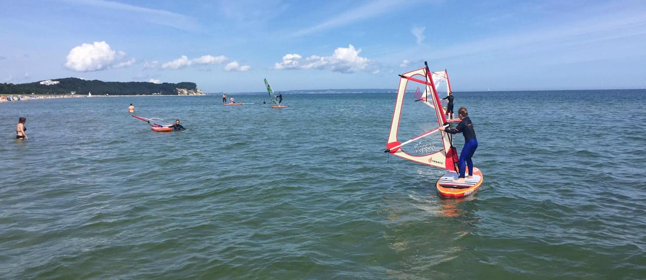 The open sea with a windsurfer on his board during Windsurfing Lessons for Kids (from 6 y.) in Göhren with ProBoarding Rügen.