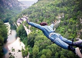 A man is jumping during his Bungee Jumping "Le 107" in Gorges du Tarn (107m) with Elastic Natural Bungee.