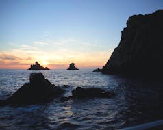 Der wunderschöne Sonnenuntergang, den Sie während der Bootstour zu den Calanques de Piana ab Porto mit Avventu Event's genießen können.