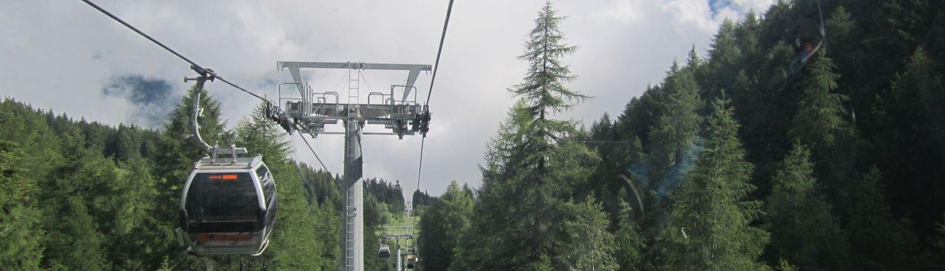 A beautiful gondola lift takes participants at the starting point of the Intermediate Mountain Bike Downhill Tour in Val di Sole.