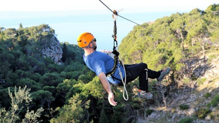 A person enjoying the Zipline in Tučepi on the Makarska Riviera with Sea View with Tip-Extreme Travel Agency Tučepi.
