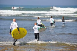 Group of surfers having fun with Ericeira Surf School.