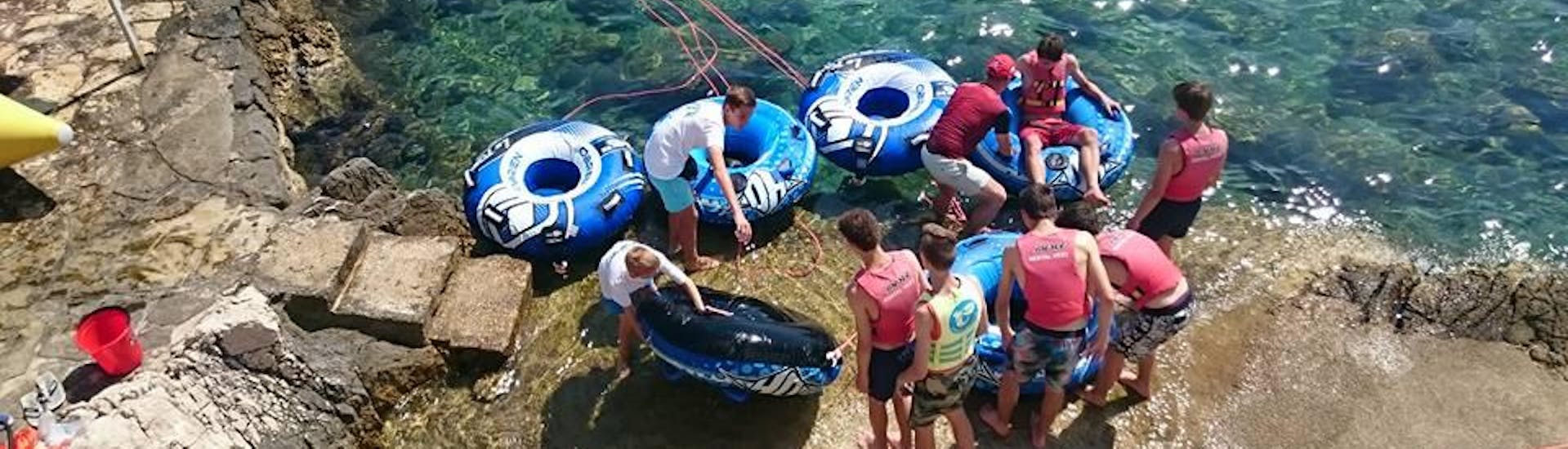 People getting ready for a Water Tube Ride in Kvarner Bay with Water Sport Centar Selce