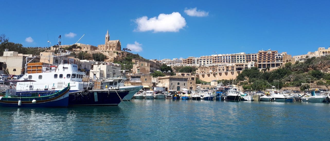 The beautiful harbor of Gozo photographed by boat during the Speedboat Trip to Blue Lagoon & Sightseeing Bus Tour on Gozo.