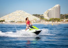A man is having fun while jet skiing during his tour with Jet Ski Hire in Villeneuve-Loubet with Plage des Marines.