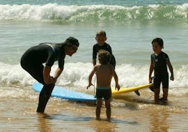 3 children have a private surfing lesson on the sail fish beach for all levels with the nomad surf school.