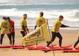 The group during the warming up of the advanced surfing lessons (from 16 y.) on Praia da Arrifana with Arrifana Surf School.