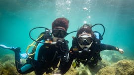 A participant scuba diving in Santa Pola during a tour offered by Dive Academy Santa Pola.