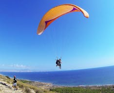 Someone is flying during the Tandem Paragliding at Costa Blanca - Panorama Flight with Parapente Santa Pola.