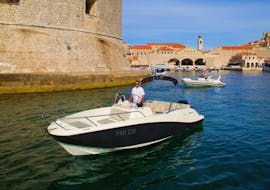 A skipper from Explore Dubrovnik by Boat is about to to take tourists on board of the Private Boat (6pax) to Elaphiti Islands with Snorkeling.