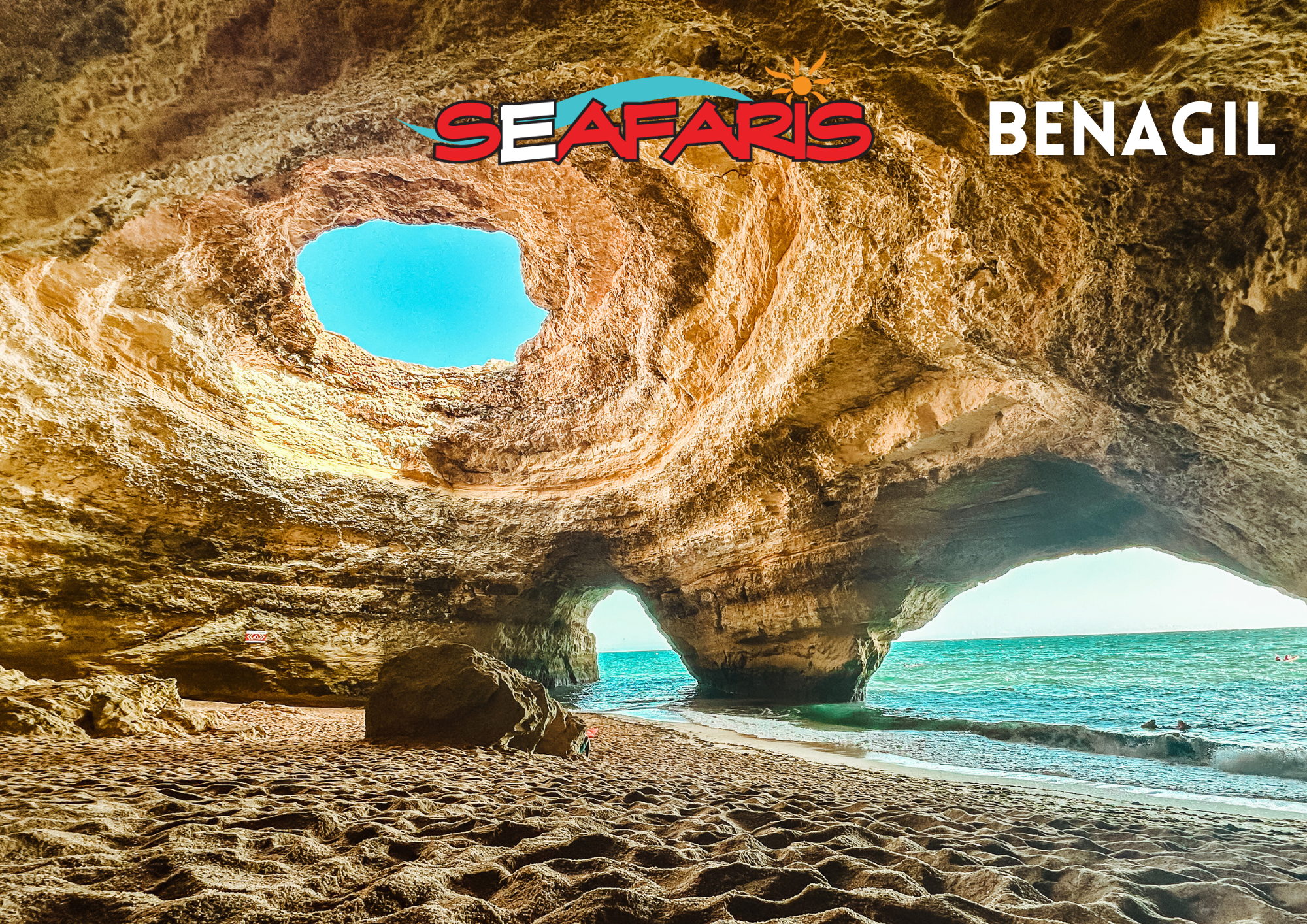 View from inside Benagil Cave on a Dolphin Seafaris tour. The sun shines through the oculus of the Benagil Cave onto the sandy beach below during the Lagos: Benagil Cave & Sea Caves Boat Tour from Dolphin Seafaris Algarve.