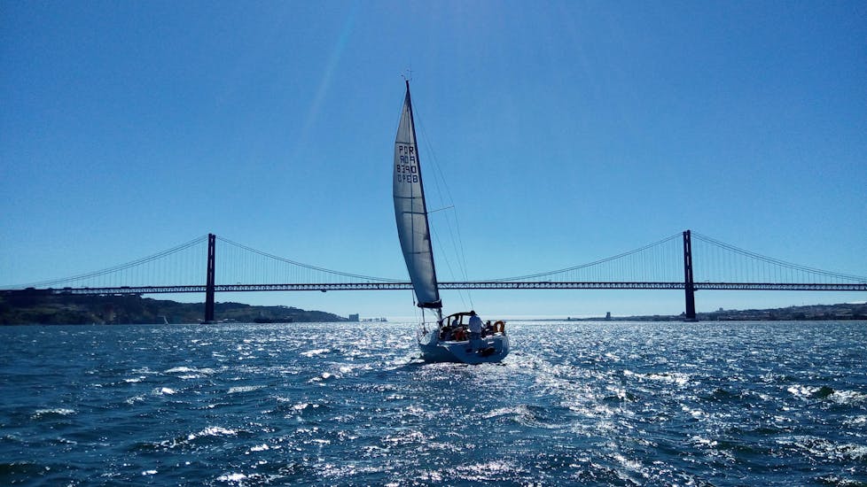 A boat in the sun during the Private Sailing Boat Trip on the Tagus River