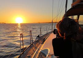 Private Sunset Sail on the Tagus incl. Praça do Comércio with Lisbon by Boat A person enjoying their Private Sunset Sail on the Tagus