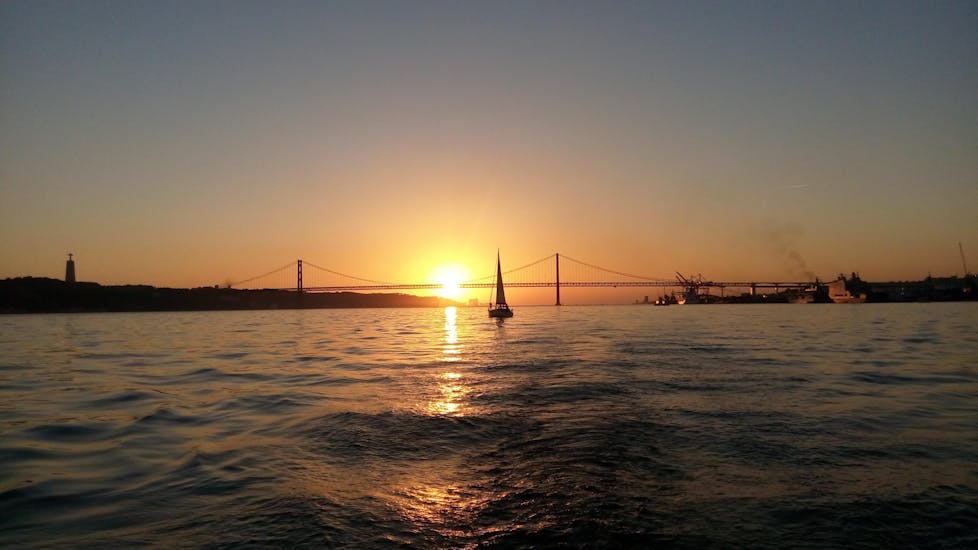 A boat in the water during the Sunset Sail tour on the Tagus
