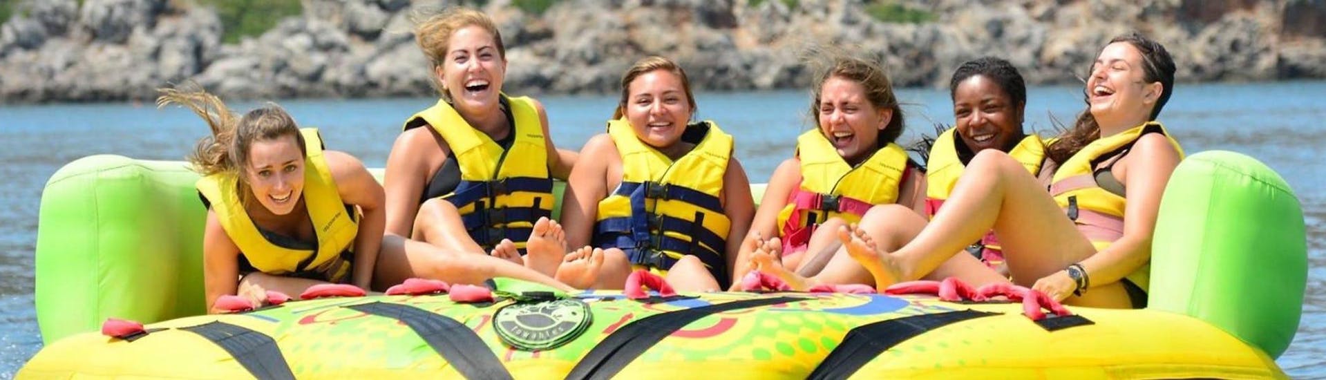 A group of friends is enjoying their Sofa Ride and Tour in Agia Marina activity with Cactus Water Sports Center.