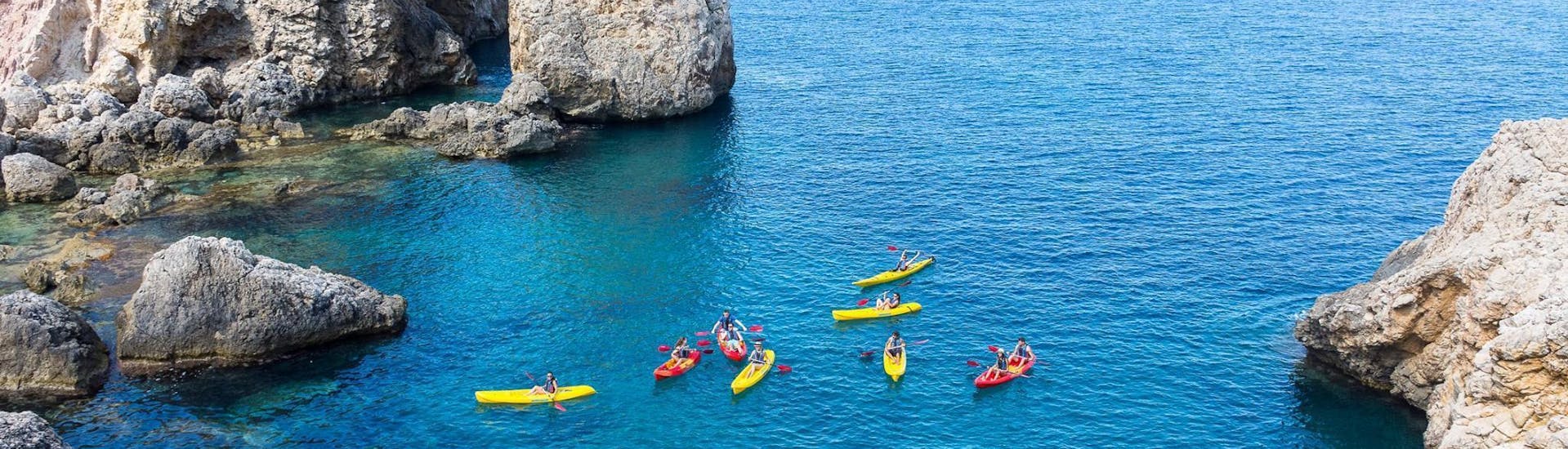 A group of participants kayaking in the Malgrats Islands with rentals offered by ZOEA Mallorca.