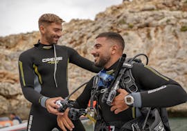 Instructor is teaching scuba diving with PADI Scuba Diver Course in Chania for Beginners from Blue Adventures Diving Chania.