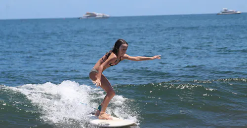 Private Surf Lessons in Biscarosse incl. Transfer with It's On Surf School Arcachon A kid is having her Private Surfing Lessons for All Levels from 8 years with It's On Surf School.