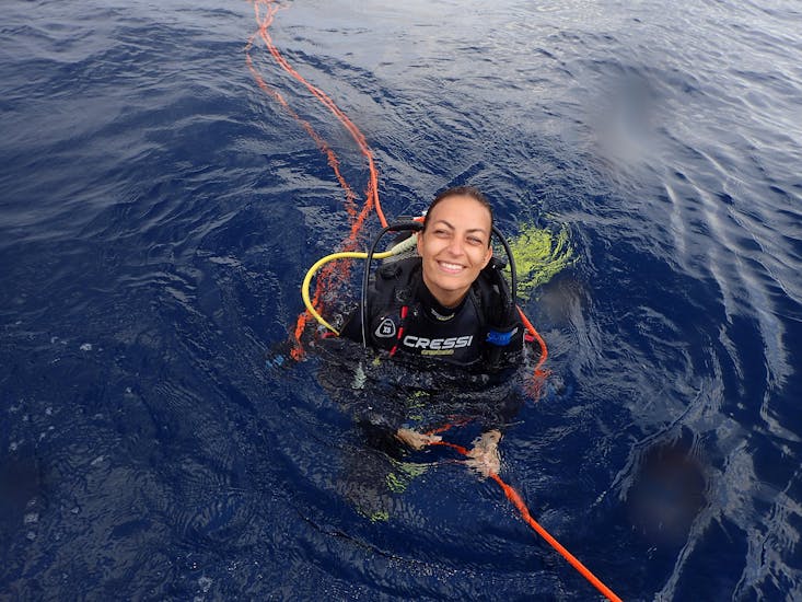 Diver smiling during her PADI Advanced Open Water Diver in Santorini.