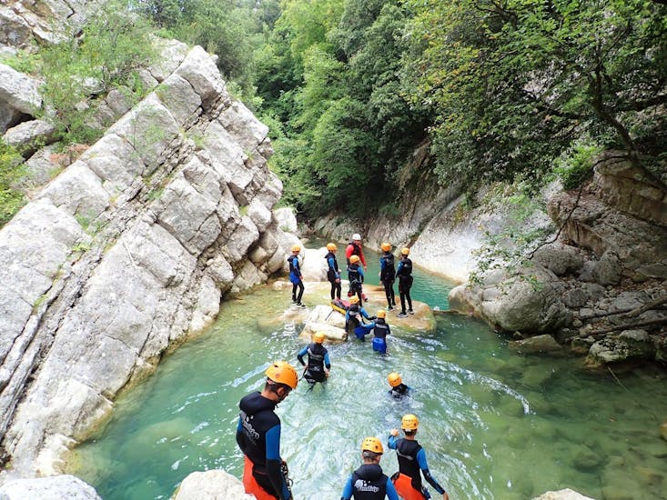A group of children is having fun in the river during their Canyoning in the Gours du Ray Canyon - Aquatic tour with FunTrip.